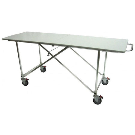 View of a raised hydraulic embalming table, demonstrating its height adjustment and practical design.